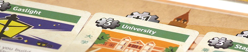 closeup of game cards, with the words 'University' and 'Gaslight'